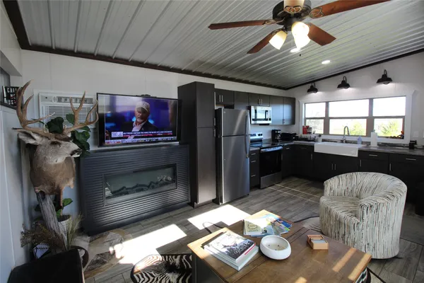 a kitchen with furniture and a fireplace