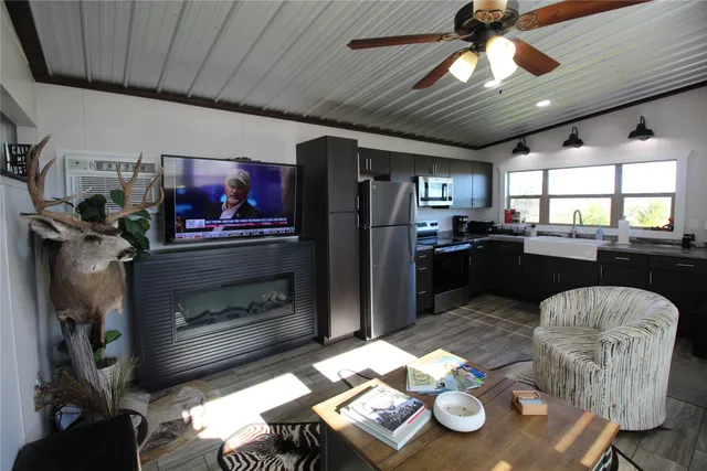 a kitchen with furniture and a fireplace