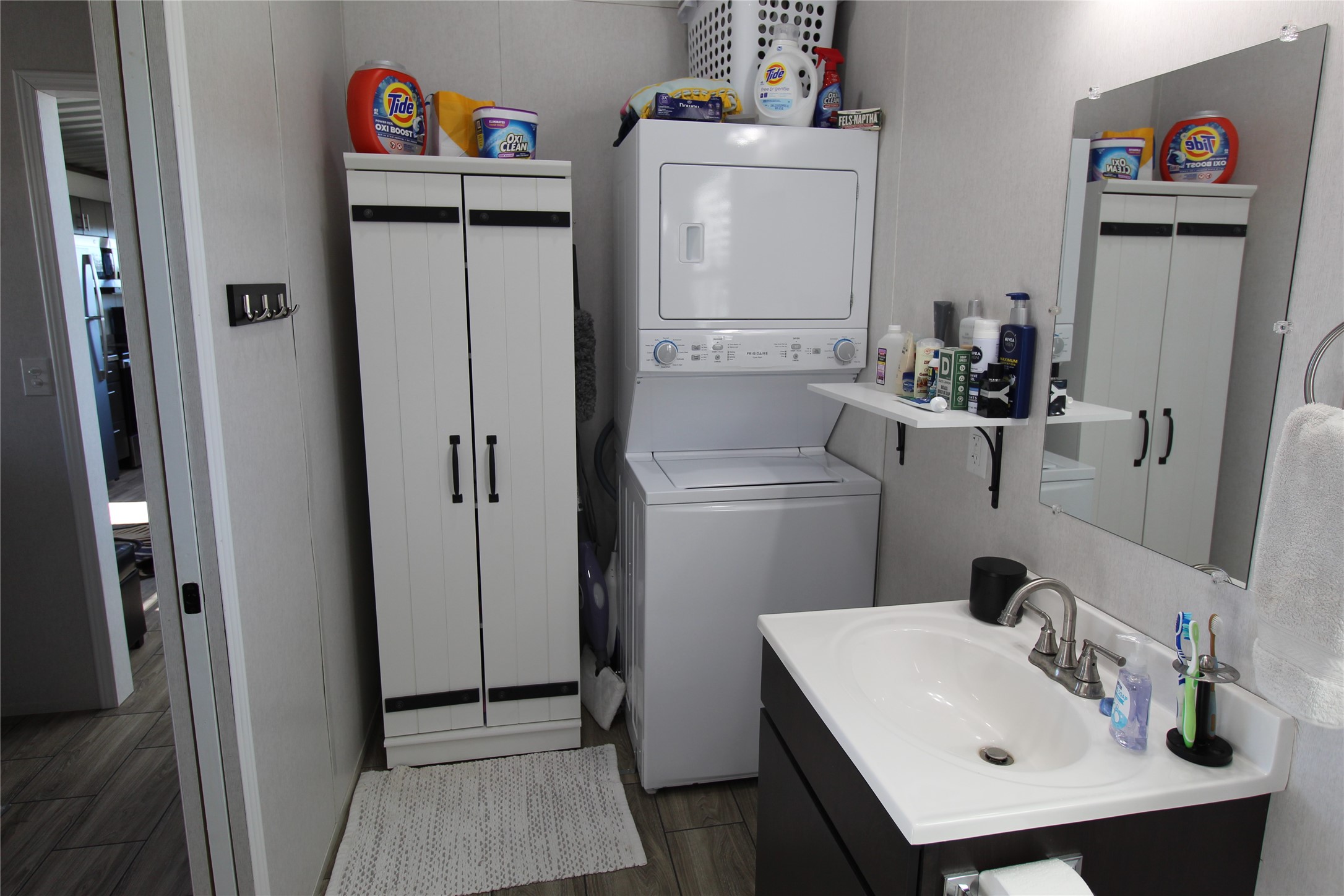 1524 Shaws Bend Road Columbus, TX 78934 - Photo 8 of 19 a bathroom with a sink and a refrigerator