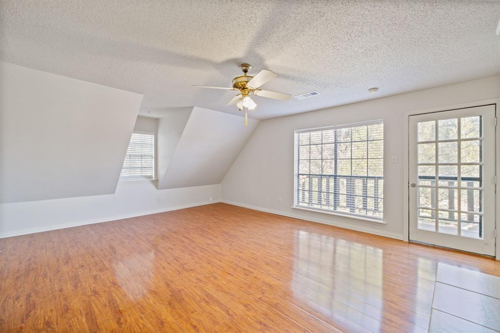 212 Magic Lane Sunnyvale, TX 75182 - Photo 14 of 22 wooden floor in an empty room with a window