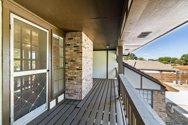 a balcony with wooden floor
