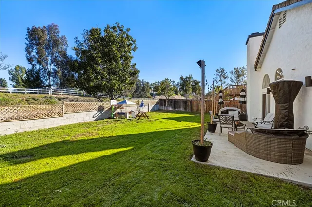 a view of a swimming pool and a yard