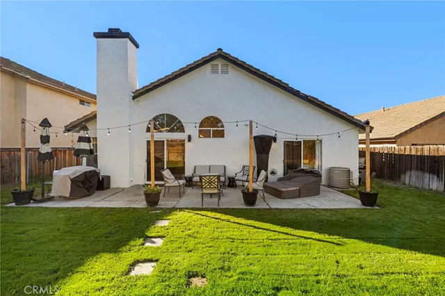 a front view of house with yard and seating area