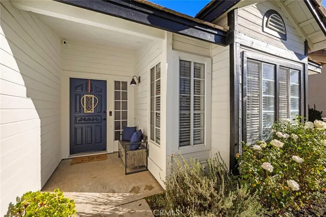 a view of front door and small yard
