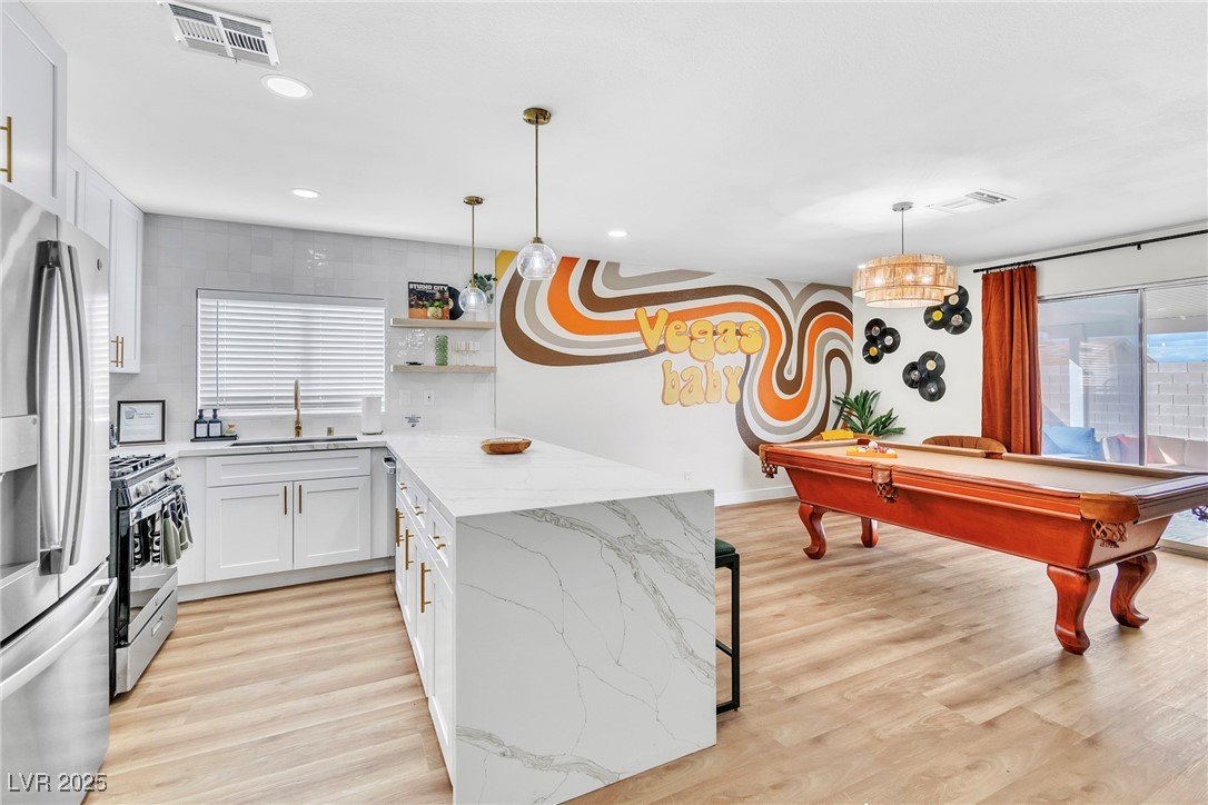 Kitchen featuring appliances with stainless steel