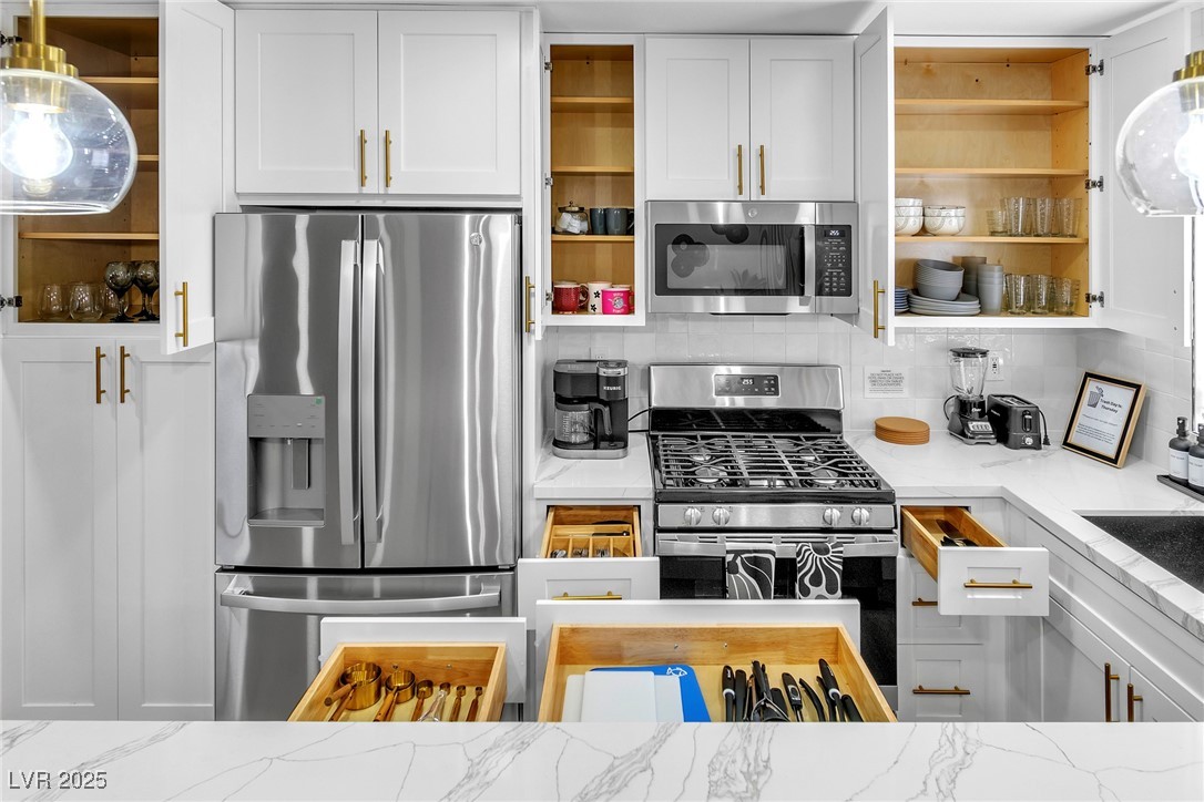 425 Golden Valley Drive Henderson, NV 89002 - Photo 16 of 48 Kitchen featuring stainless steel appliances, open
