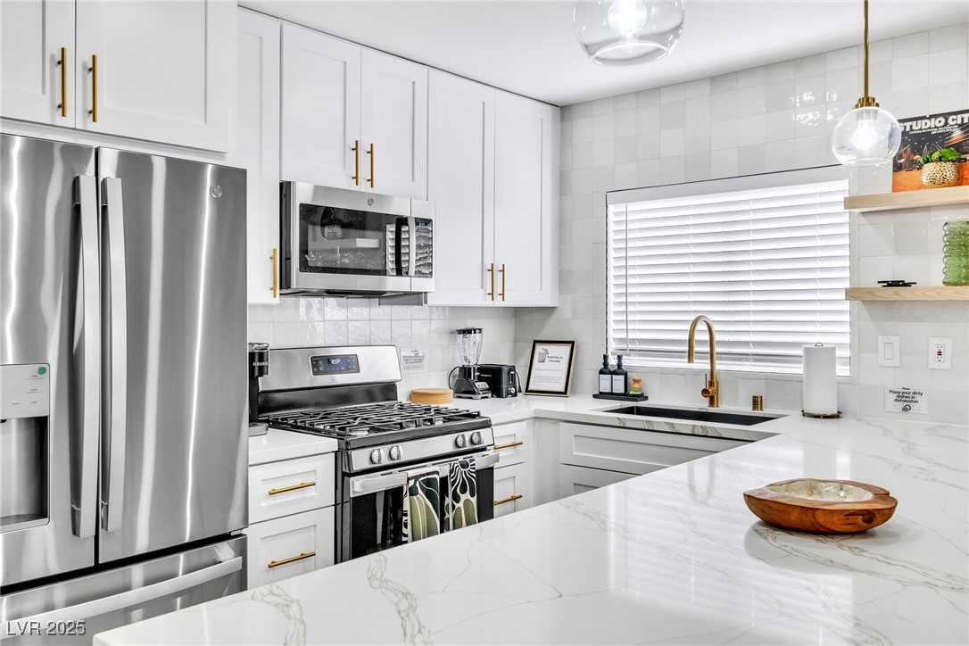 425 Golden Valley Drive Henderson, NV 89002 - Photo 2 of 48 Kitchen with stainless steel appliances, tasteful