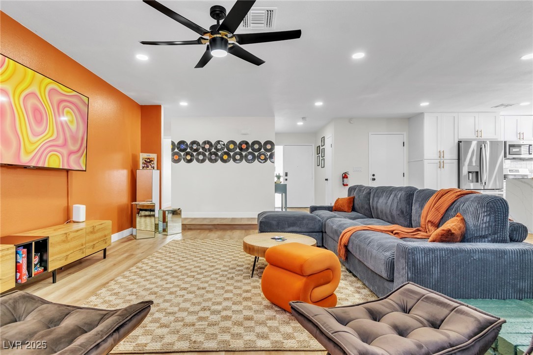 425 Golden Valley Drive Henderson, NV 89002 - Photo 21 of 48 Living room with recessed lighting, light wood fin