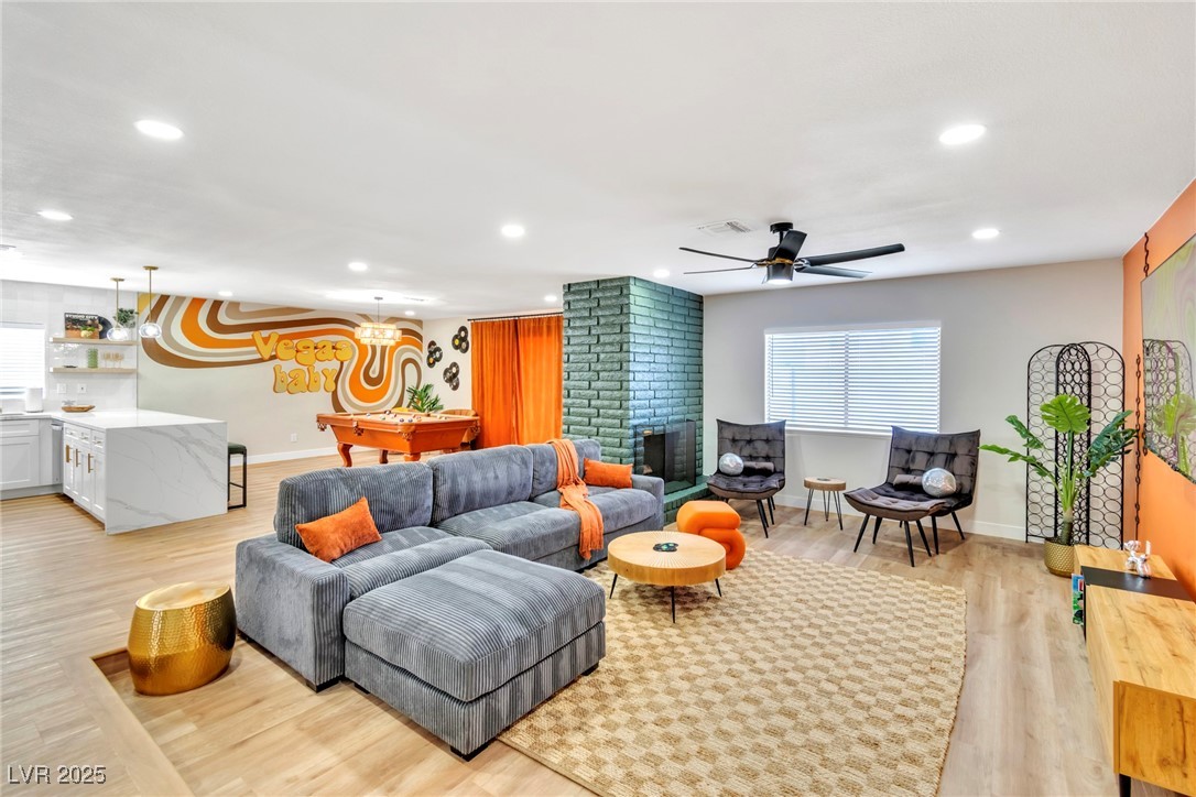 425 Golden Valley Drive Henderson, NV 89002 - Photo 22 of 48 Living room with recessed lighting, light wood-typ