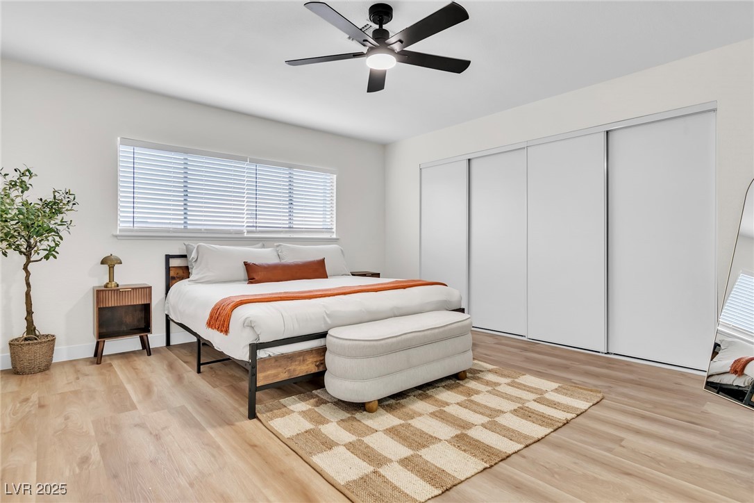 425 Golden Valley Drive Henderson, NV 89002 - Photo 26 of 48 Bedroom featuring light wood finished floors, a cl