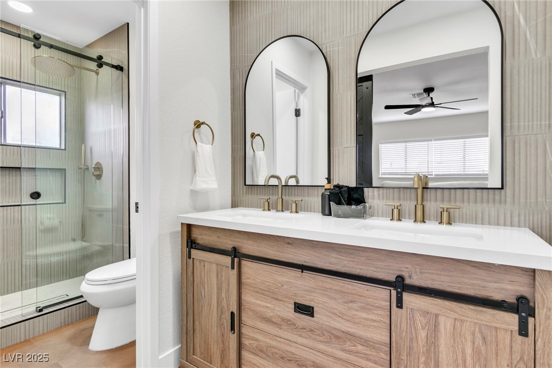425 Golden Valley Drive Henderson, NV 89002 - Photo 33 of 48 Full bathroom with double vanity, a stall shower,