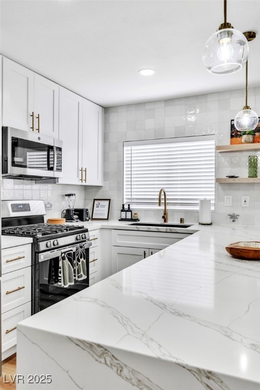 425 Golden Valley Drive Henderson, NV 89002 - Photo 8 of 48 Kitchen featuring stainless steel appliances, deco