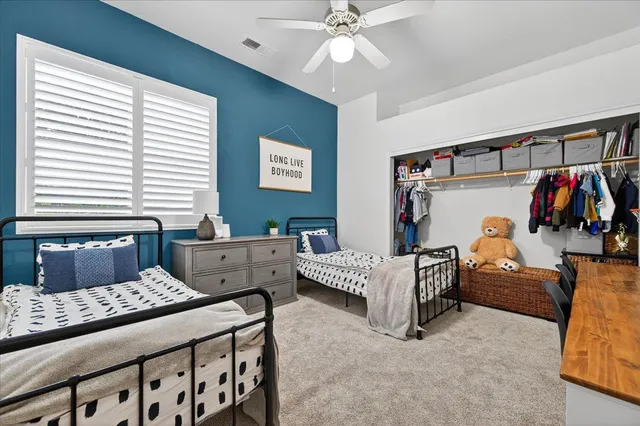 a bedroom with furniture and white walls