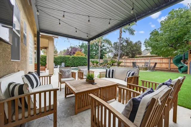 a view of a patio with couches chairs dining table and chairs