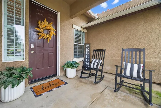 a outdoor living space with furniture and a potted plant