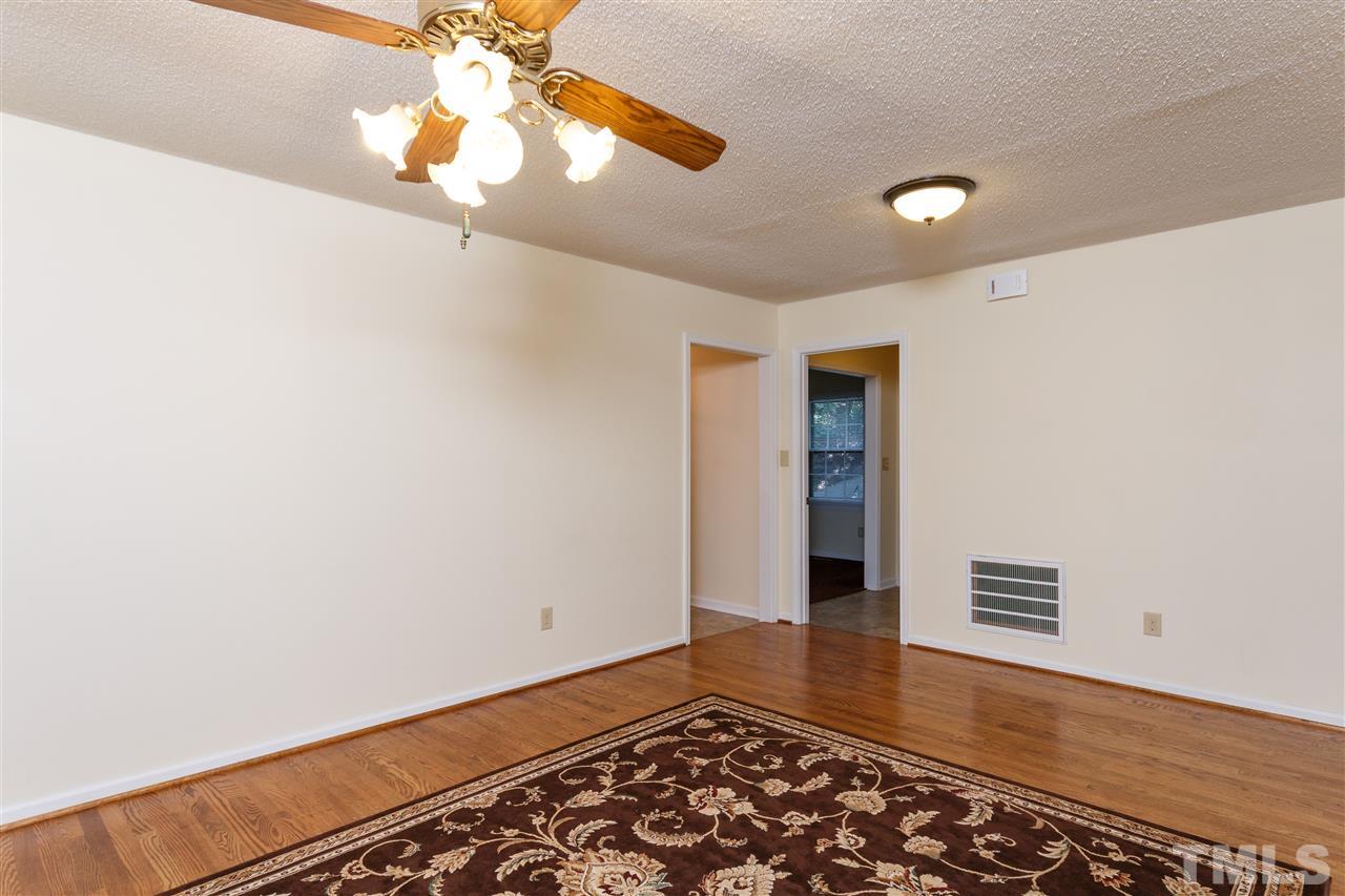 6629 Coach Light Circle Raleigh, NC 27613 - Photo 4 of 25 wooden floor in an empty room