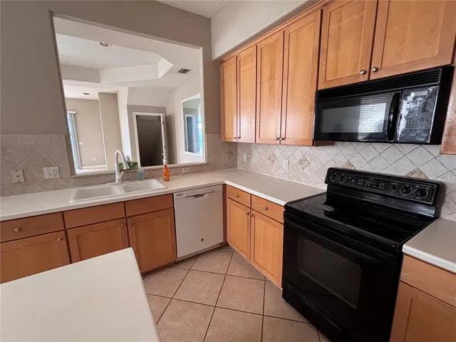 a kitchen with a stove and a microwave