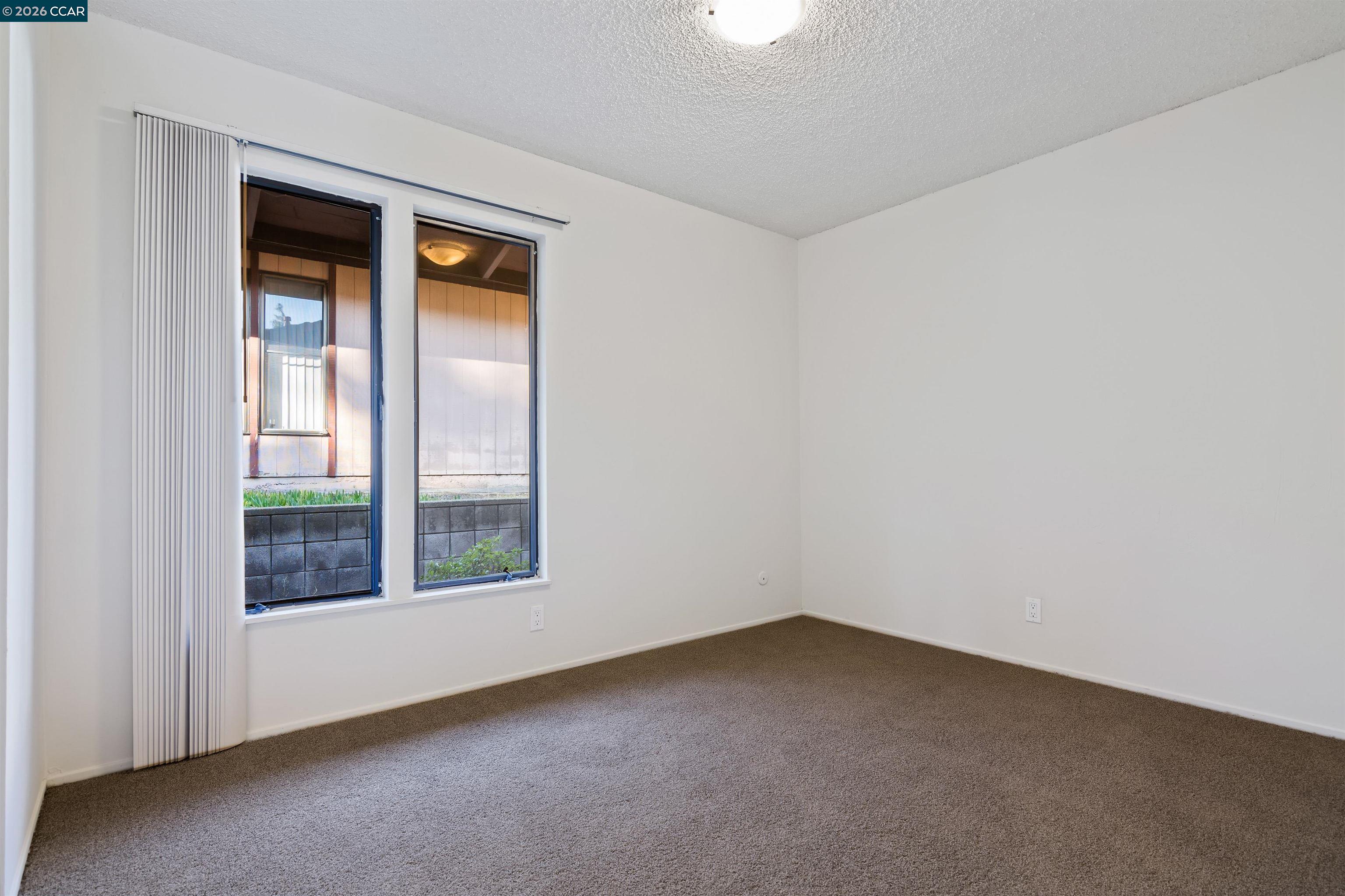 238-240 Camelback Road Pleasant Hill, CA 94523 - Photo 23 of 36 an empty room with a window