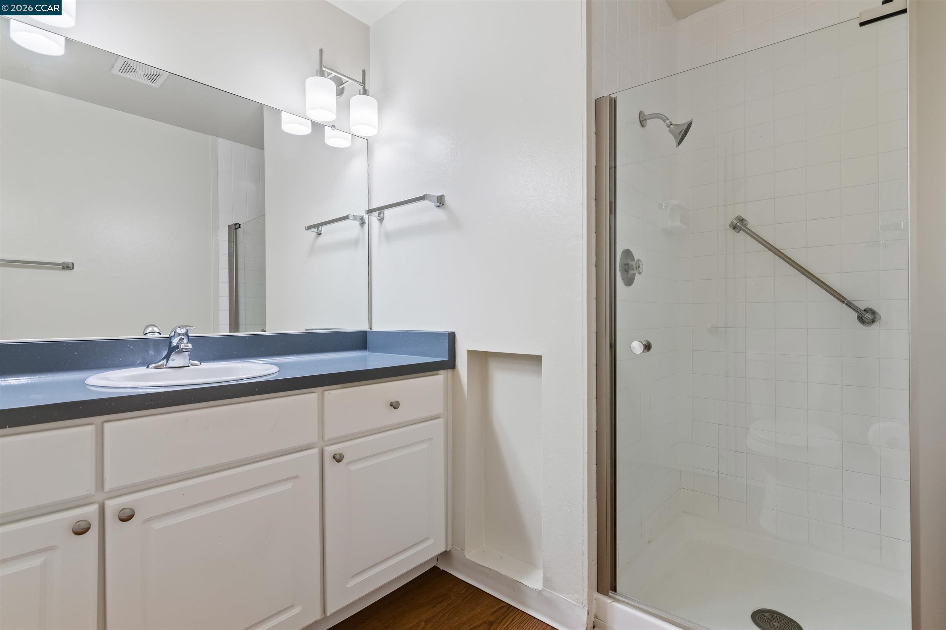 238-240 Camelback Road Pleasant Hill, CA 94523 - Photo 27 of 36 a bathroom with a double vanity sink and mirror