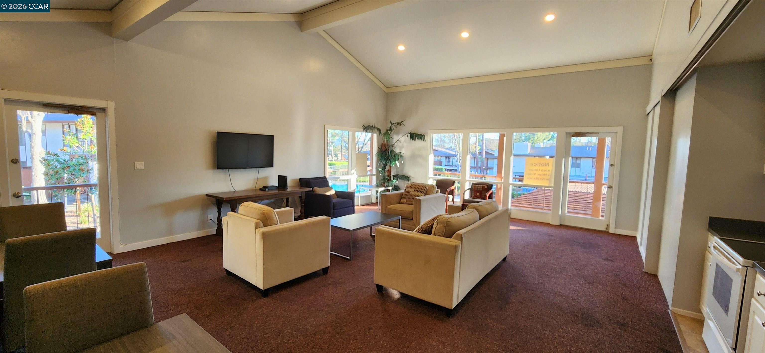 238-240 Camelback Road Pleasant Hill, CA 94523 - Photo 33 of 36 a living room with furniture and a flat screen tv