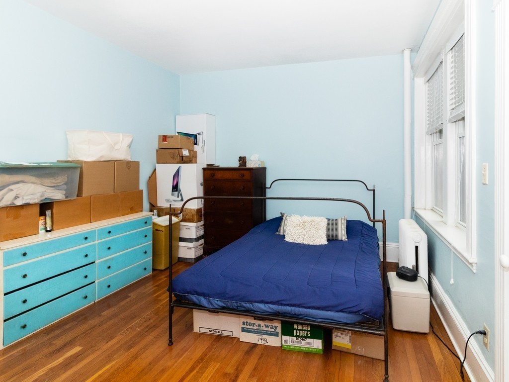 38 Kilsyth Road, Unit 22 Brookline, MA 02445 - Photo 12 of 18 a bed room with a bed and a dresser