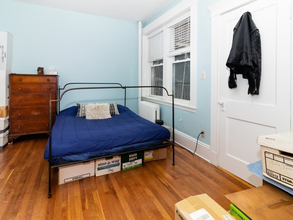 38 Kilsyth Road, Unit 22 Brookline, MA 02445 - Photo 13 of 18 a room with a bed and dresser