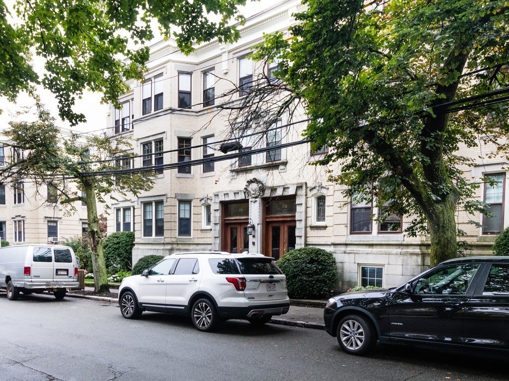 38 Kilsyth Road, Unit 22 Brookline, MA 02445 - Photo 18 of 18 a car parked in front of a white house