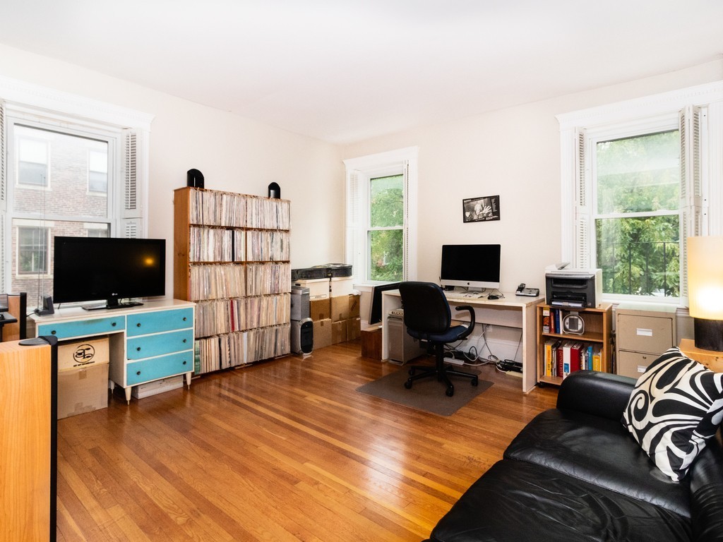 38 Kilsyth Road, Unit 22 Brookline, MA 02445 - Photo 7 of 18 a living room with furniture window and a flat screen tv
