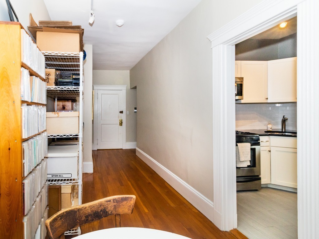 38 Kilsyth Road, Unit 22 Brookline, MA 02445 - Photo 10 of 18 a kitchen with granite countertop a refrigerator and a stove top oven