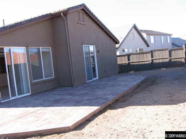 491 Alysheba Court Reno, NV 89521 - Photo 8 of 9 a view of a house with wooden fence