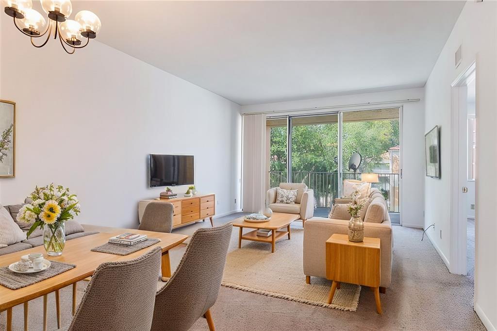 a living room with furniture fireplace and flat screen tv