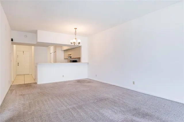 a view of a kitchen with a sink and a fireplace