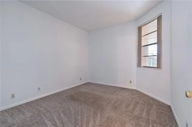 a bathroom with a sink toilet double vanity and shower