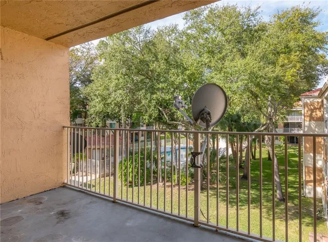 a front view of a building with tree s