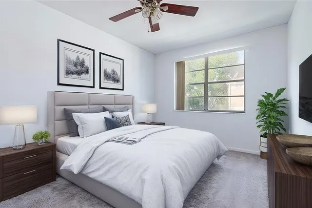 a bedroom with a large bed and a window