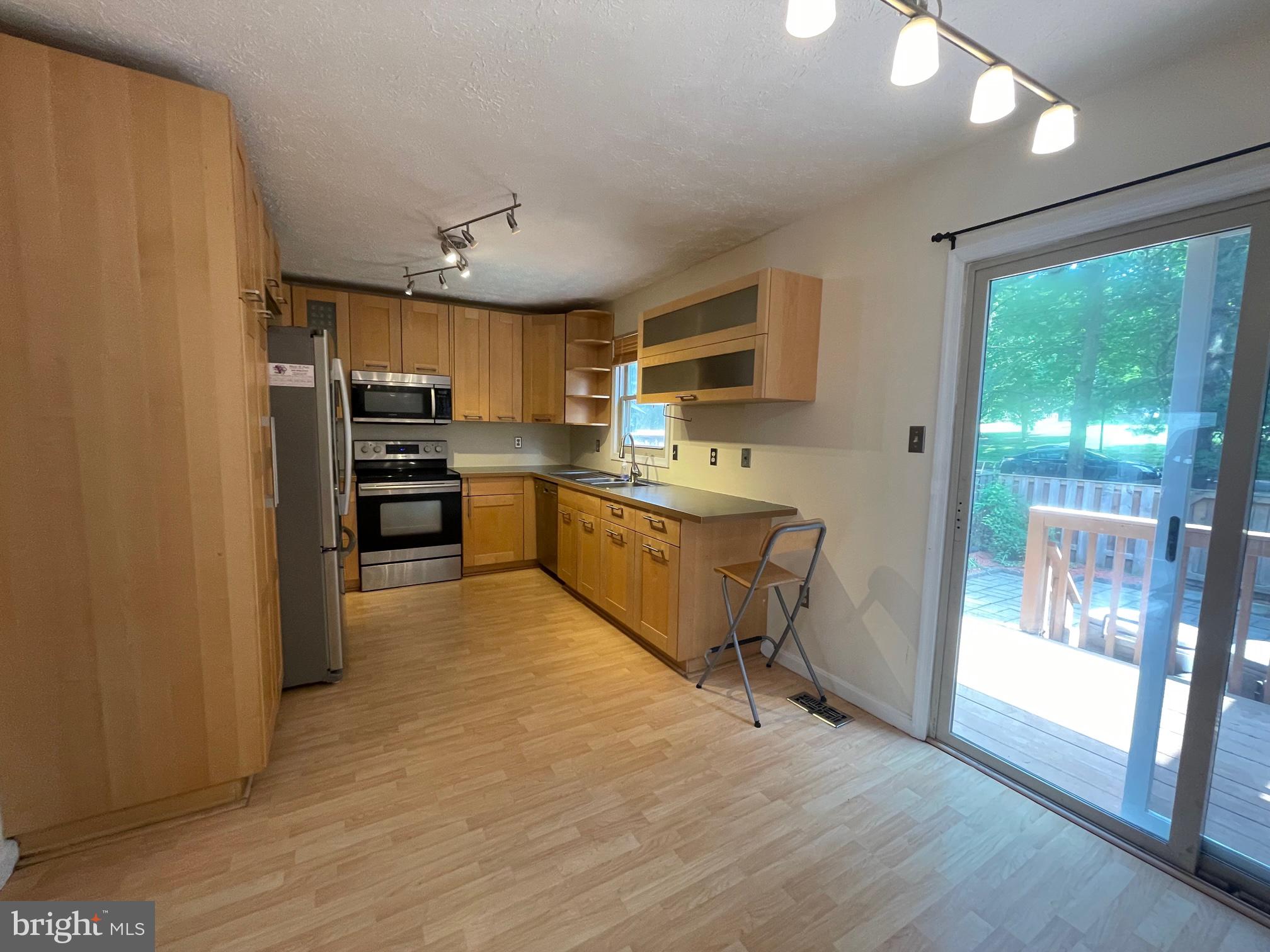 857 Flagler Drive Gaithersburg, MD 20878 - Photo 6 of 19 kitchen with eat in area overlooking backyard