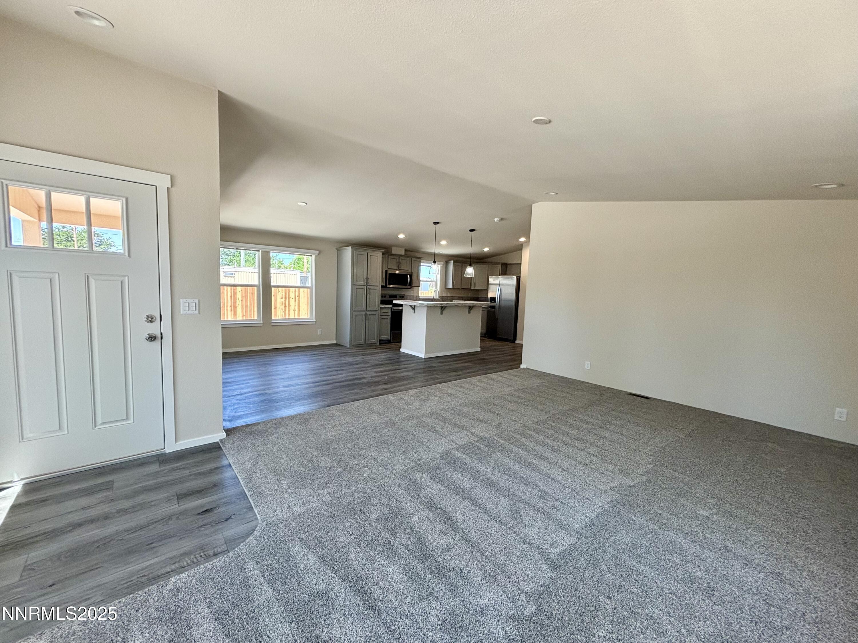 750 16th Street Lovelock, NV 89419 - Photo 2 of 17 a view of empty room with wooden floor and window