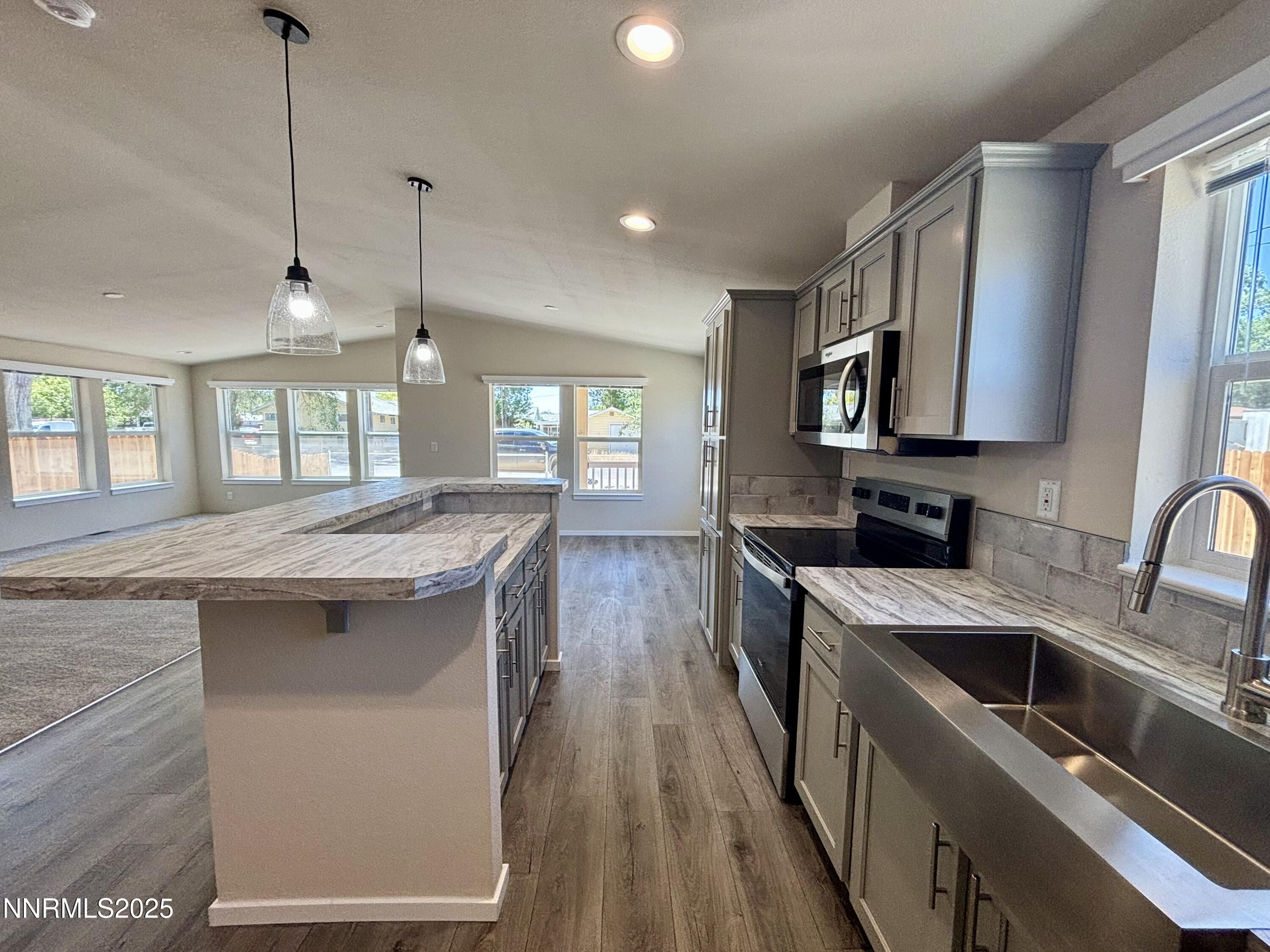 750 16th Street Lovelock, NV 89419 - Photo 3 of 17 a kitchen with a stove sink and cabinets