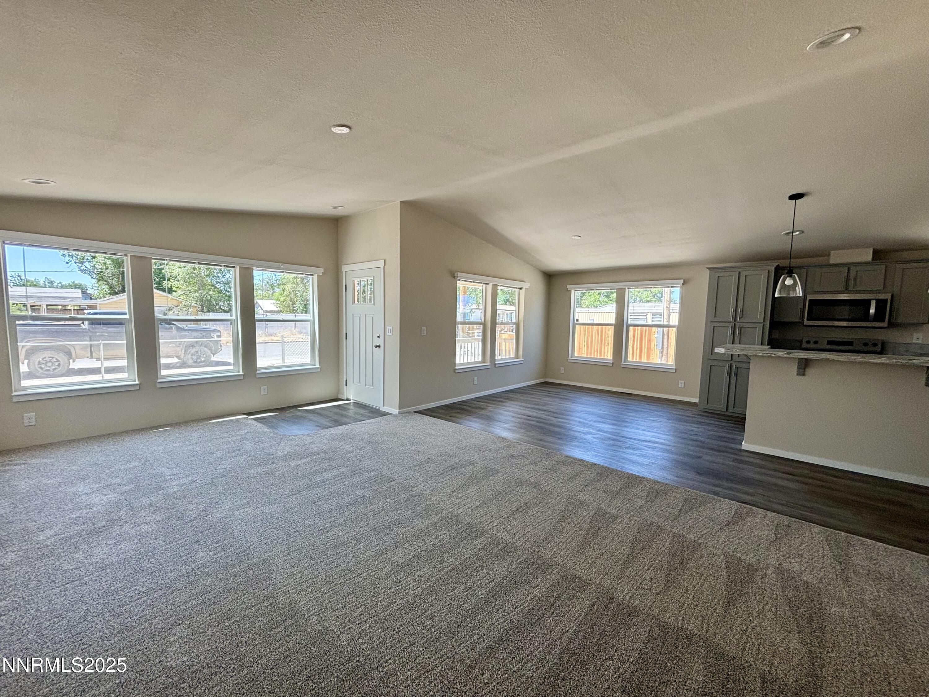750 16th Street Lovelock, NV 89419 - Photo 8 of 17 a view of an empty room with a window and wooden floor