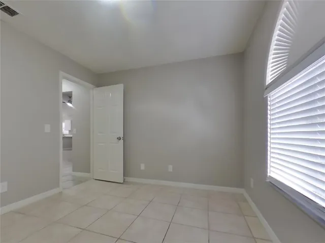 a view of an empty room and window