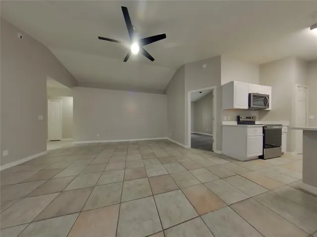 a view of a kitchen with a sink and a microwave