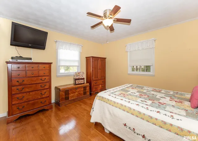 a bedroom with a bed and a dresser