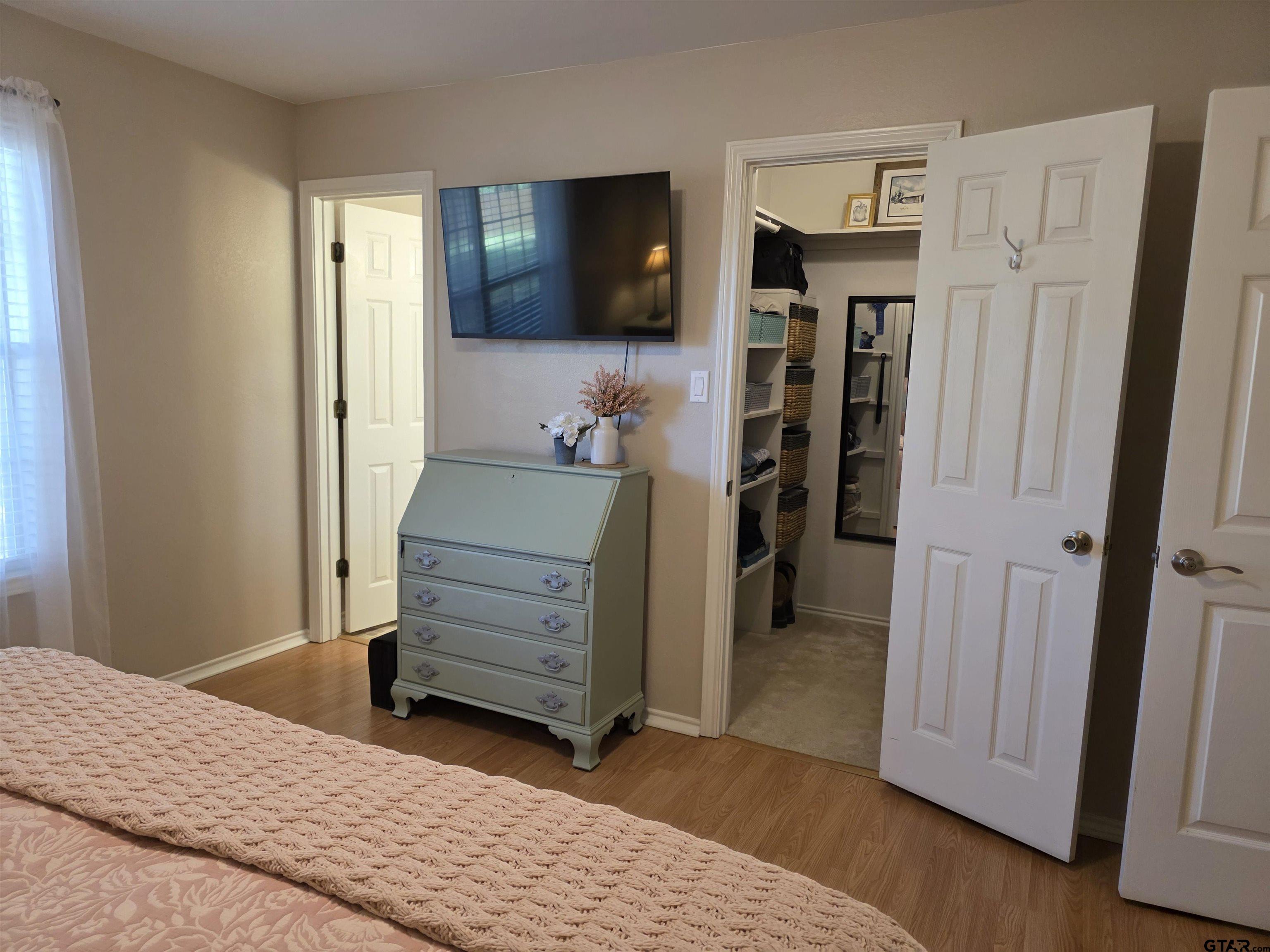 6170 Highway 271 Mount Pleasant, TX 75455 - Photo 22 of 43 a bedroom with a bed and a television