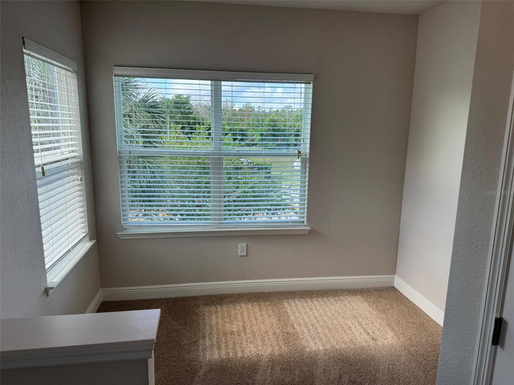 2420 Ann Rou Road, Unit 201 Tavares, FL 32778 - Photo 4 of 25 a view of an empty room with a window