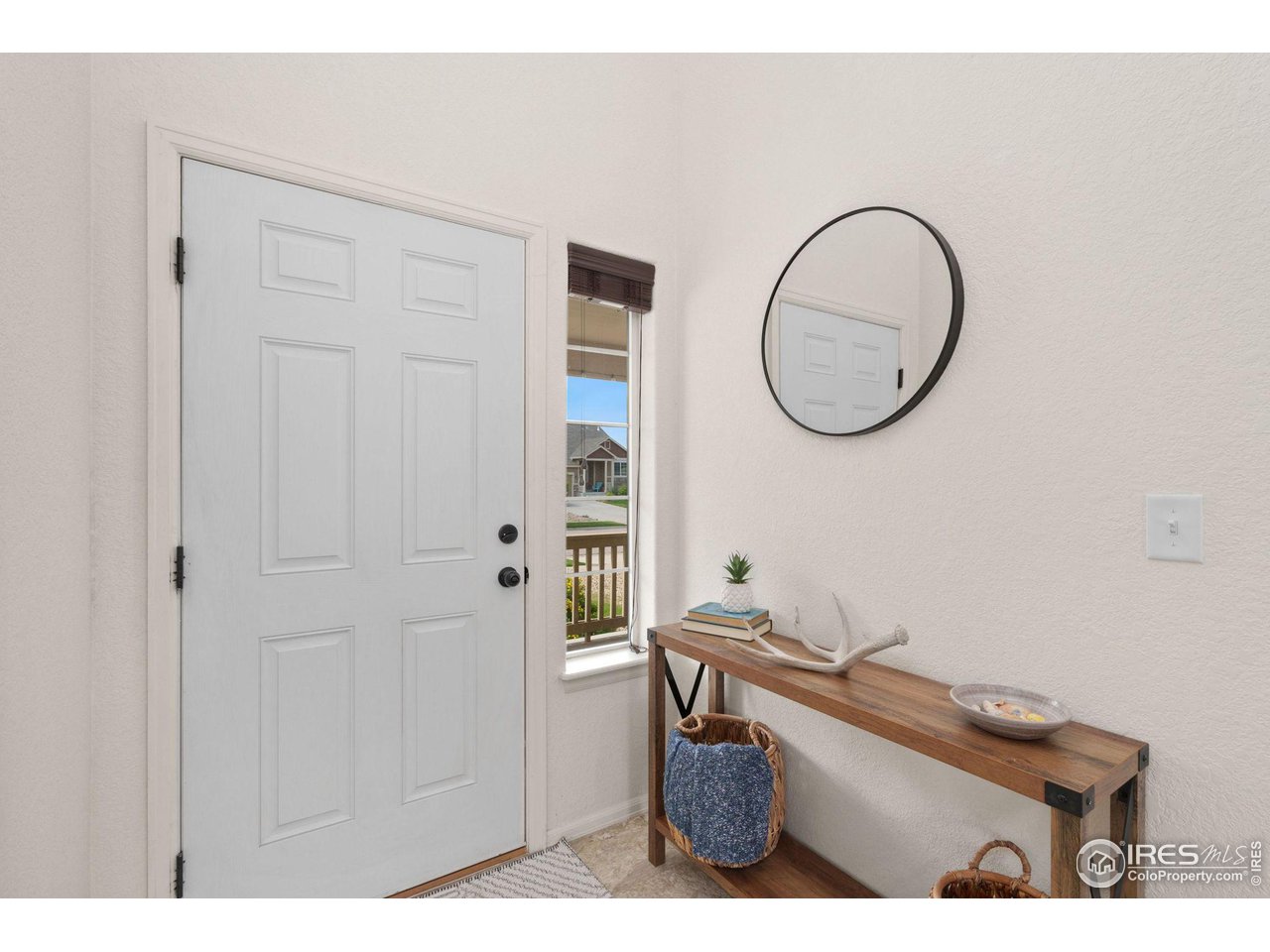 Welcoming front foyer with soaring ceilings