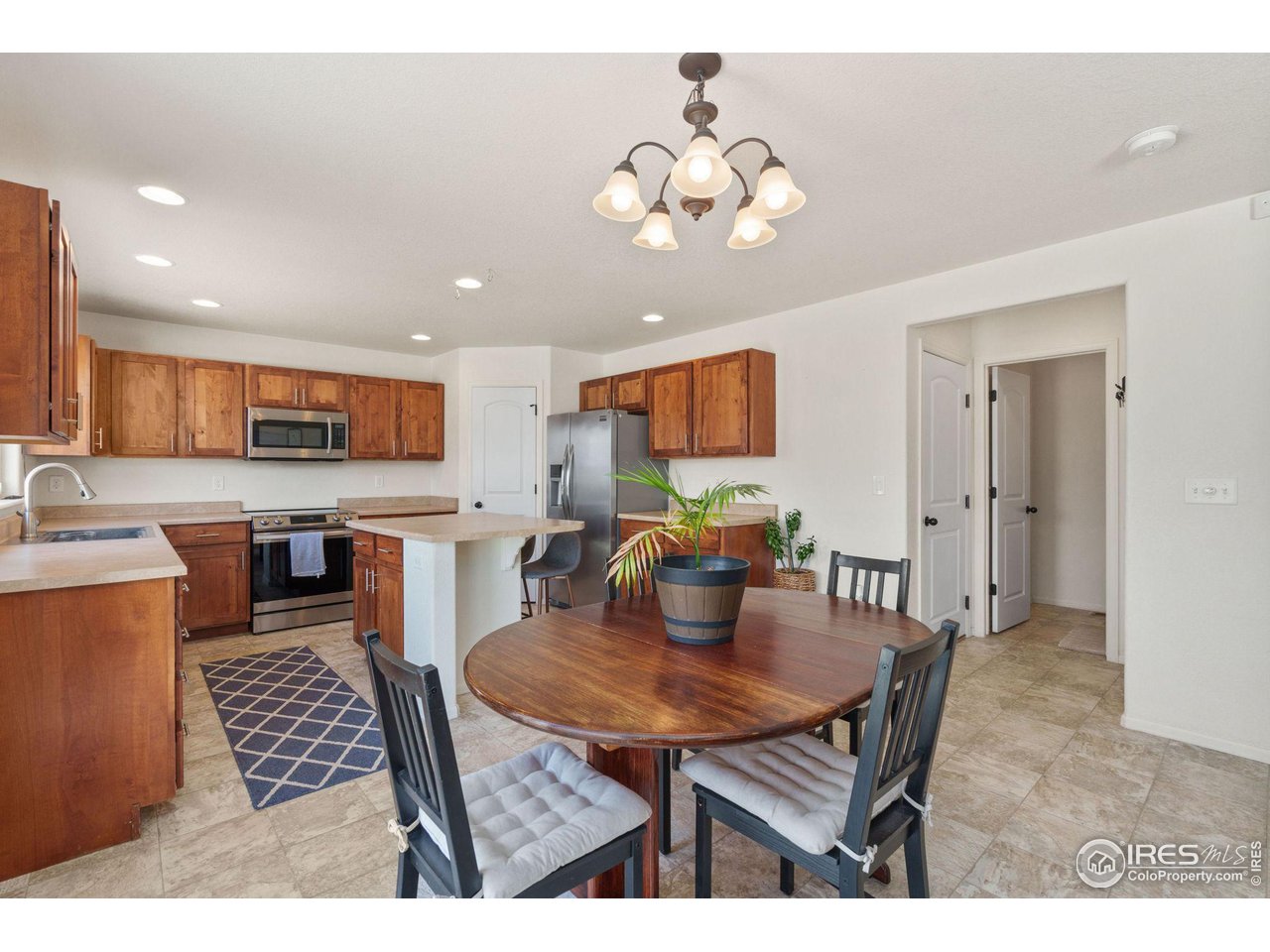 7808 West 11th St Road Greeley, CO 80634 - Photo 9 of 25 Plenty of cabinets in this large kitchen