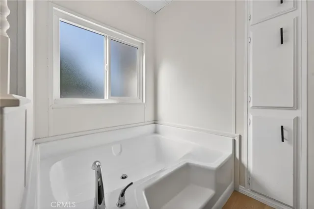 a city street with tall buildings in the background