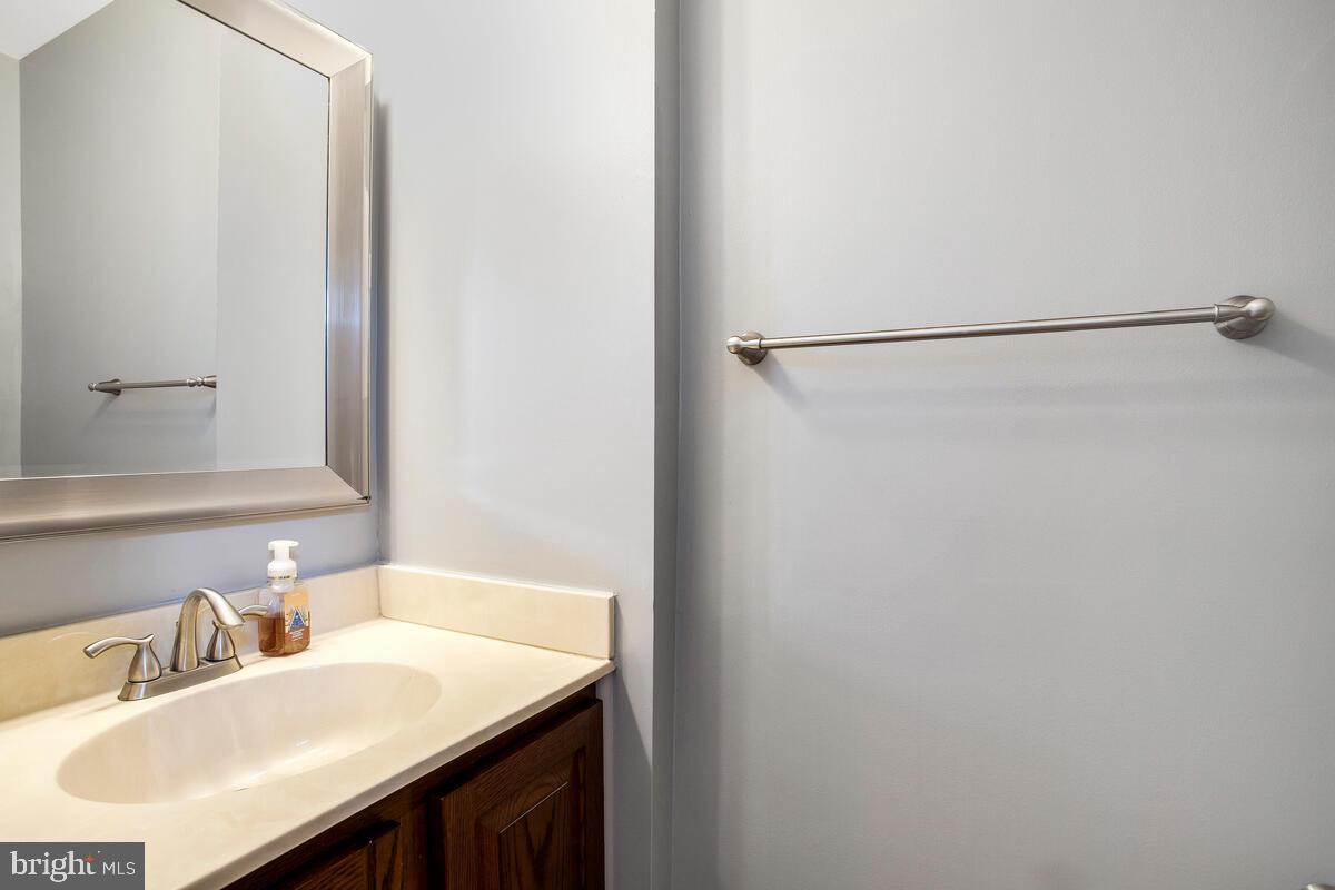 4 Offspring Court Perry Hall, MD 21128 - Photo 11 of 38 a bathroom with a sink and a mirror