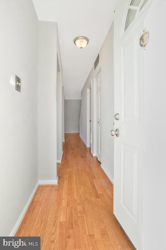 4 Offspring Court Perry Hall, MD 21128 - Photo 13 of 38 a view of a hallway with wooden floor and staircase