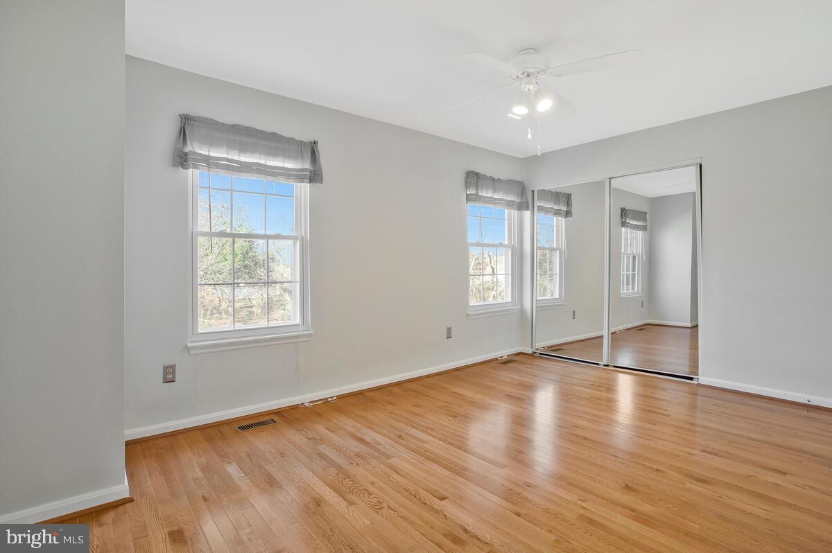 4 Offspring Court Perry Hall, MD 21128 - Photo 14 of 38 an empty room with wooden floor and windows
